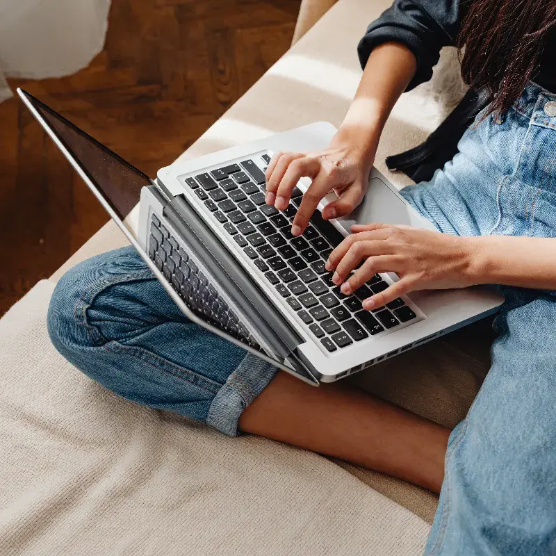Someone working on a laptop